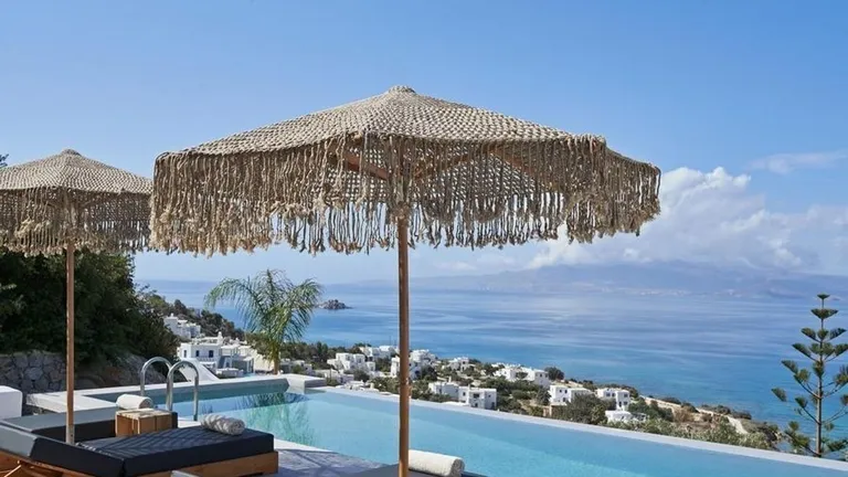  patio terrace umbrella seashore coast seacoast sea-coast thatch thatched roof-0