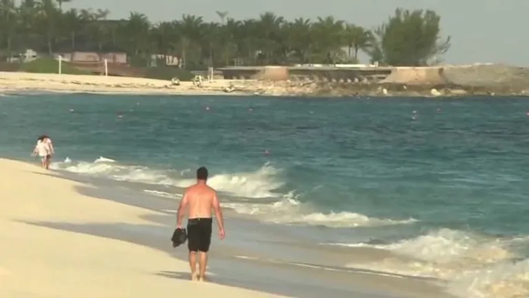  sandbar sand bar seashore coast seacoast sea-coast swimming trunks bathing trunks promontory headland head foreland-0